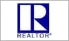 A blue and white logo for realtor. Com